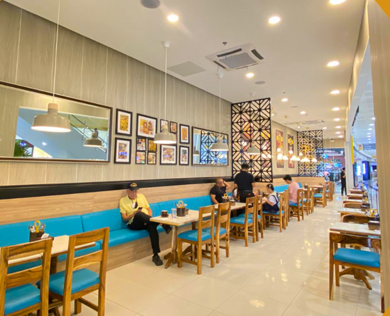 Customers chilling inside Old Town White Coffee SM Grand Central Branch. Photo by SM Grand Central Facebook Page