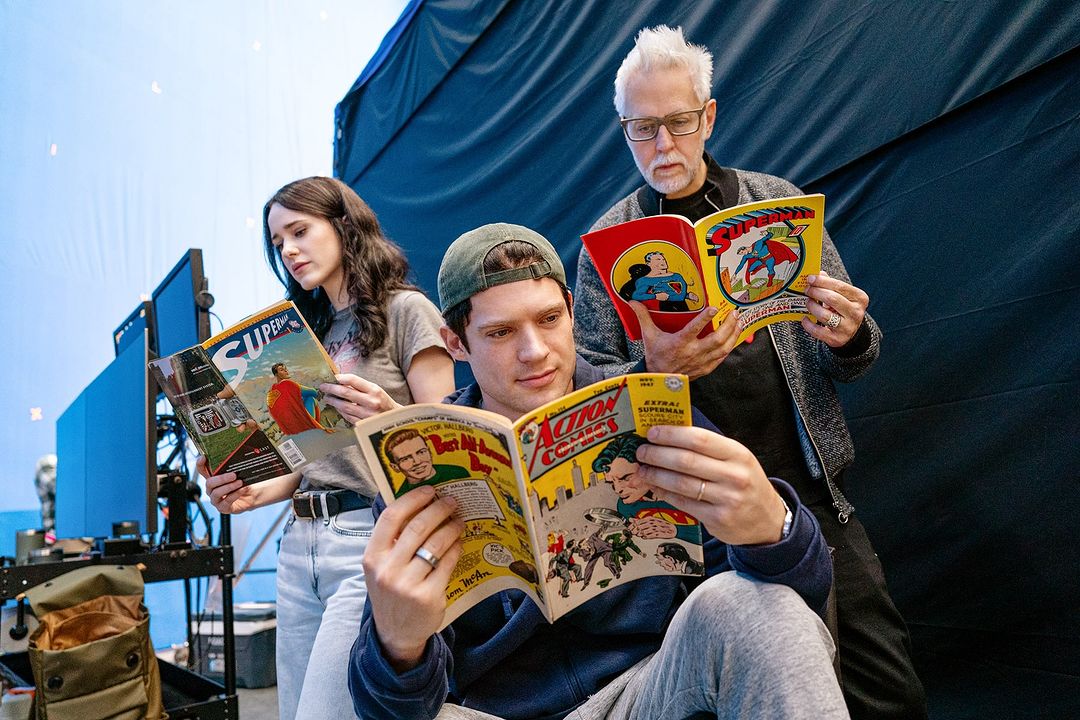 James Gunn, David Corenswet and Rachel Brosnahan reading comics that will inspire the new movie.