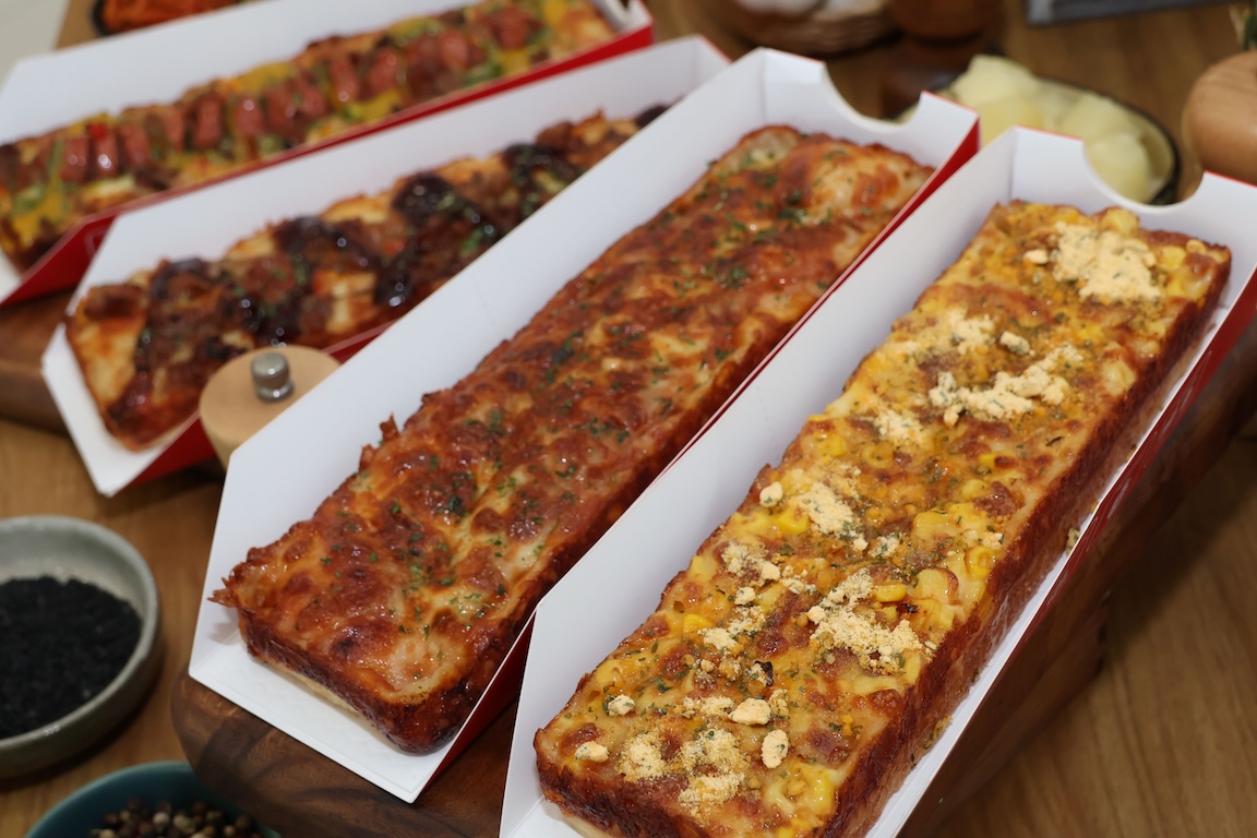 Eat Pizza Slide faves, arranged from left to right, Korean Sausage, Beef Bulgogi, Classic Cheese, and Sweet Corn Cheese.