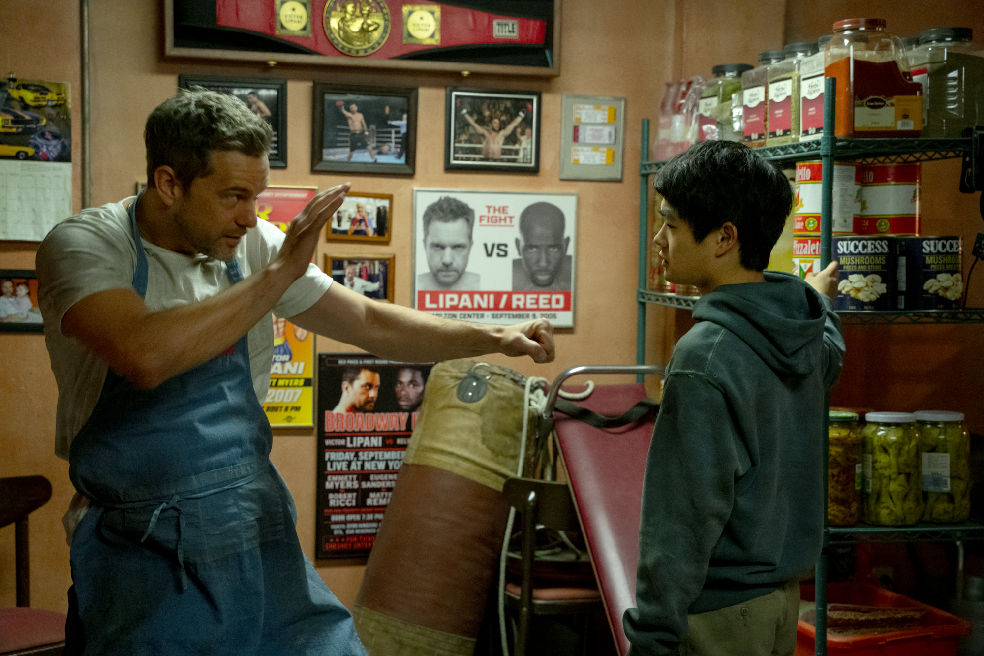 Mia's father, retired boxer Victor (Joshua Jackson) and Fong bonding together | Photo courtesy of Columbia Pictures