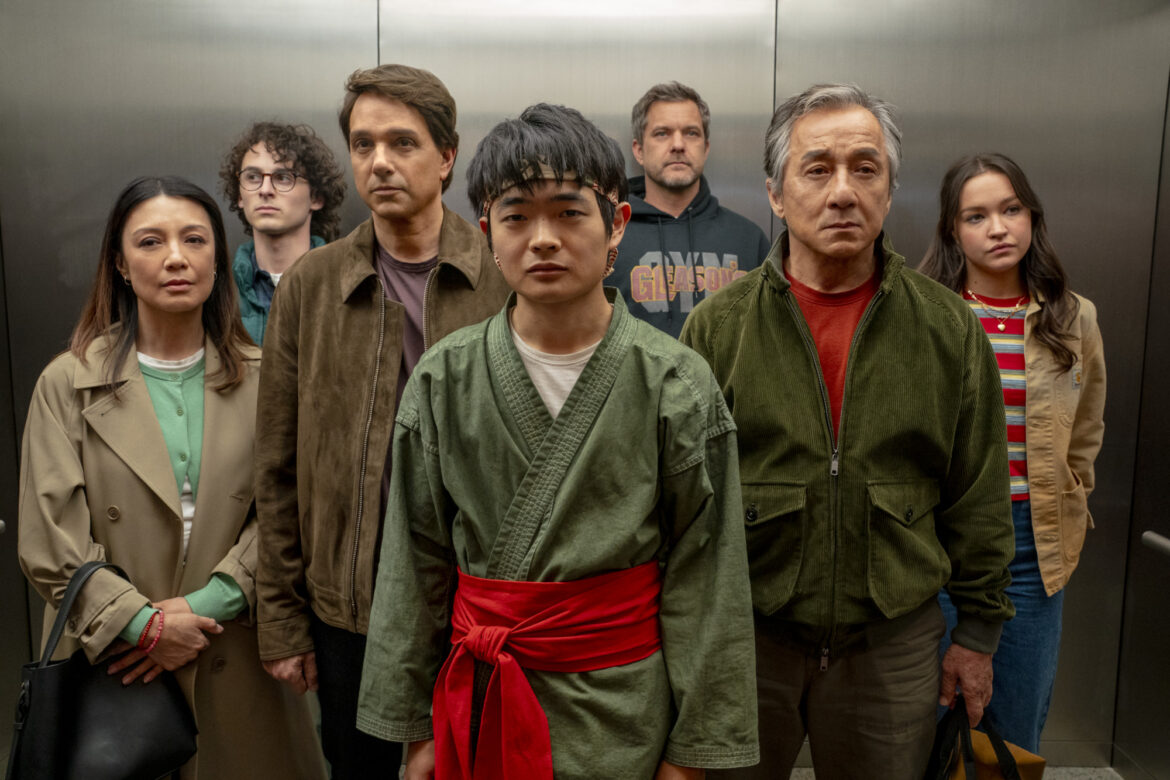 Li Fong (Ben Wang) with mentors, Mr. Han (Jackie Chan) and Daniel LaRusso (Ralph Macchio), family, and friends | Photo courtesy of Columbia Pictures