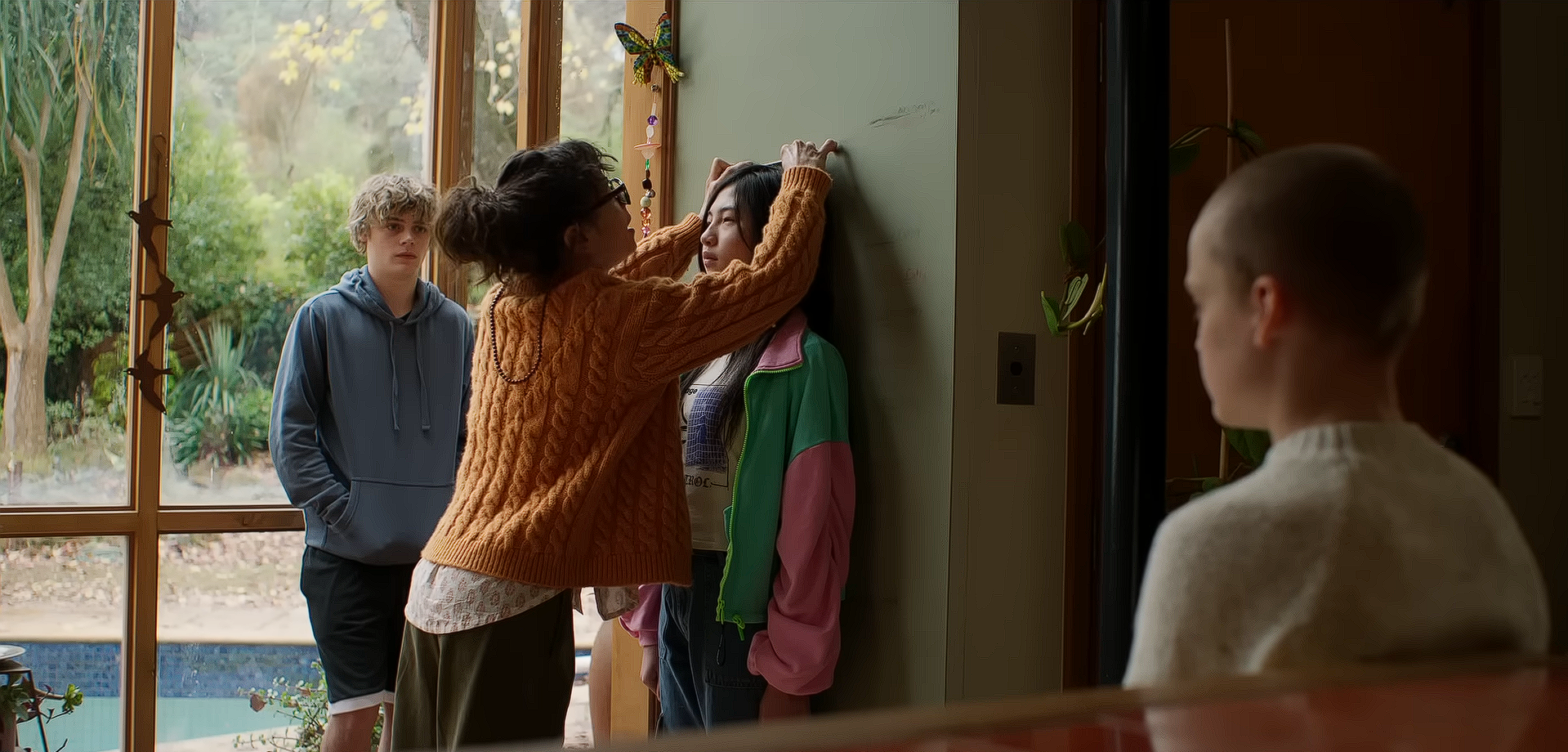 Laura (Sally Hawkins) takes Piper's (Sora Wong) height while Oliver (Jonah Wren Phillips) and Andy (Billy Barratt) watch
