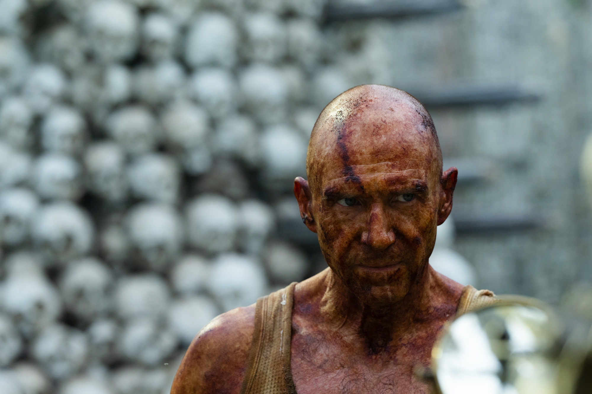 Ralph Fiennes' Dr. Kelson covered in iodine, a prophylactic against the rage virus in 28 YEARS LATER | Photo courtesy to Columbia Pictures