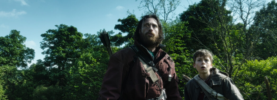 Father and son duo, Jamie (Aaron-Taylor Johnson) and Spike (Alfie Williams), leave the island in 28 Years Later | Photo courtesy of Columbia Pictures