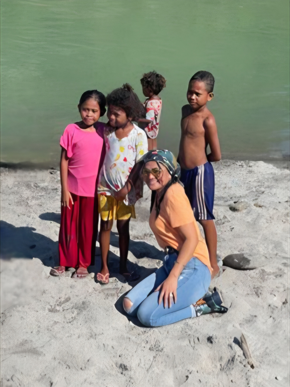 Monaliza B. Salian, President and CEO of MedEthix and I.E. Medica, shares a moment with Aeta children.