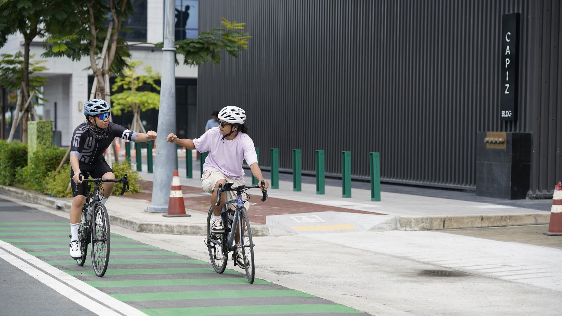 Cyclists navigate Parqal's dedicated bike lanes, highlighting the development's pedestrian-friendly design and commitment to promoting active and sustainable lifestyles